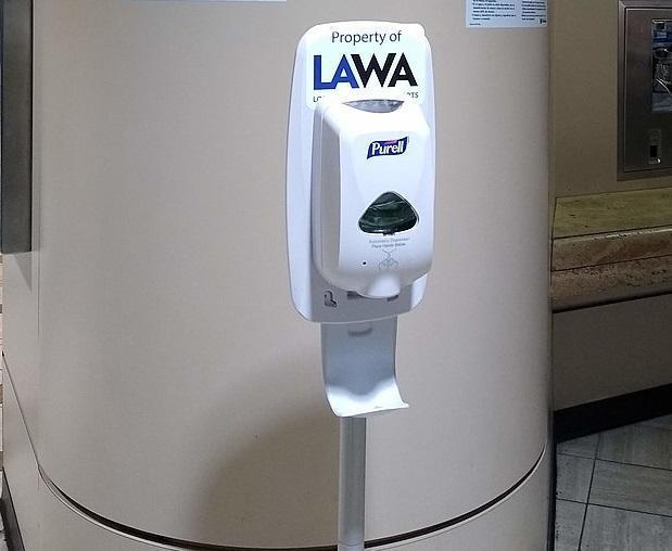 Hand_sanitizer_and_signs_at_Los_Angeles_International_Airport