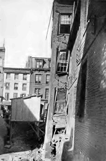 FIG. 1. DAMAGE CAUSED BY EXCAVATING WITHOUT ADEQUATELY SHORING THE WALL OF THE ADJOINING BUILDING.