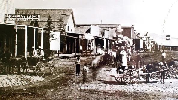 in 1868, a guy named Jacob Davis, who had been working as a tailor in different states, settled in Reno, Nevada. He helped Frederick Hertlein establish Reno's first brewery, but eventually opened up his own tailoring business on N. Virginia Street. He supplied tents, blankets, and other materials for laborers and tradesmen in the mines and railroads. There's even a cool photo from 1868 showing downtown Reno, including Jacob Davis' tailor shop, which was recorded on a glass plate. Anyway, in 1871, Davis was asked to make a pair of pants for a woodcutter who needed something tough and durable. To solve the problem of pants wearing out too quickly, Davis came up with a clever idea: using metal rivets to strengthen the pants. This innovation not only pleased his customer but also led to the creation of one of the most famous brands in the world: Levi's blue jeans.