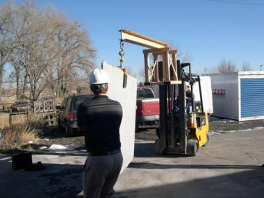 Illustrates employees staying out of the slab's fall shadow during slab transport